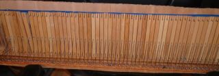 COMPLETE SET OF BRASS REEDS FROM ANTIQUE BECKWITH PUMP ORGAN IN BOARD 3