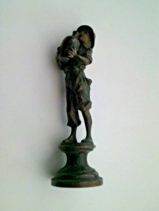 An early 20th century bronze figure of a boy holding a vase possibly Austrian 2