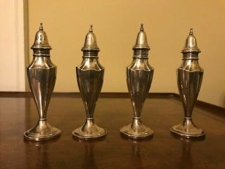Two Pairs Of Webster Sterling Silver Weighted Salt And Pepper Shakers.
