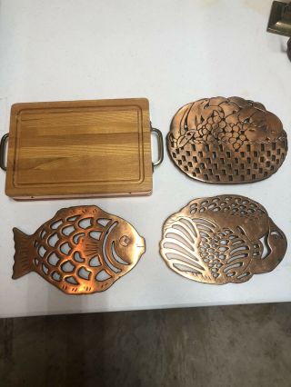 Vintage Copper Overcast Iron Trivets And Copper Trimmed Wooden Cutting Board