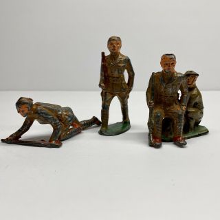 3 Vintage Wwi Die - Cast Metal Army Toy,  1 Auburn Rubberhard Rubber Army Soldier