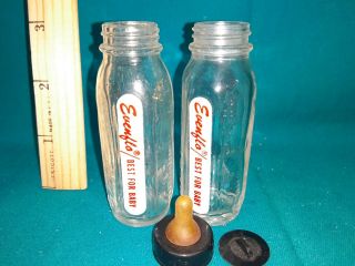 2 Vintage Glass Baby Bottles With Black Cap Evenflo Stork 8 Oz