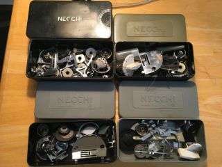 4 Boxes Of Vintage Necchi Sewing Machine Parts And Accessories Feet Bobbins Ect.