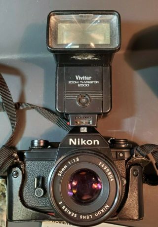 Vintage Nikon EM Camera with Leather Cover and Flash Attachment. 2