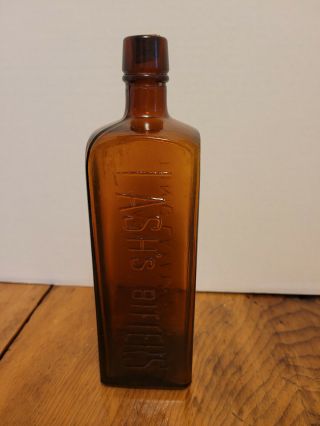 Vintage Amber Glass Bottle Embossed Lash 