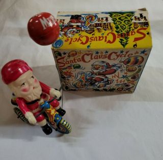 Vintage Suzuki Japan Celluloid Santa Claus On Tin Bike Christmas Wind Up Toy