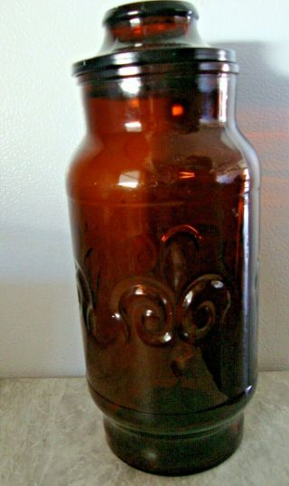 Vintage 9 Inch Tall Brown Amber Glass Jar Canister With Lid Approx.  4 Inch Wide