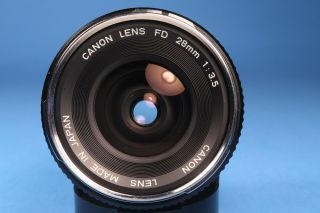 Vintage Canon Film Camera Lens FD 28mm 1:3.  5 Chrome Nose Chrome Ring 2