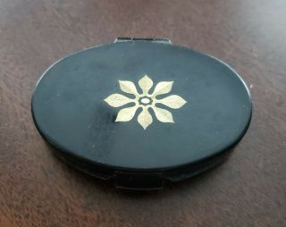 Vintage Merle Norman Compact Black With Center Gold Leaf Design And Mirror
