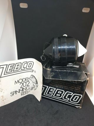 Vintage Zebco Model 202 Black With Metal Foot W/ Box & Paperwork.