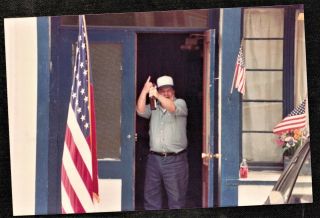 Vintage Photograph Man Holding Up Bottle Of Beer By American Flags