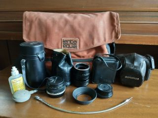 Olympus Om1 35mm Slr Camera Plus Multiple Lenses,  Accessories,  And Bag