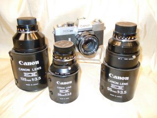 Vintage Canon Ex Auto 35mm Camera W/ 4 Lenses & Cases Collectible