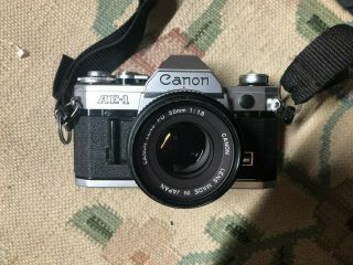 Canon Ae - 1 35mm Camera W/ Fd 50mm F 1:1.  8 Lens Plus Fd 100mm F1:2 W Hood Lense