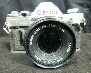 VINTAGE CANON AE - 1 35MM CAMERA W/ CANON LENS FD 50MM 1:1.  8 2