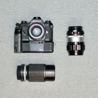 Vintage Nikon Em 35mm Slr Film Camera W/grip,  50mm,  F=135mm,  And 75 150mm Lense