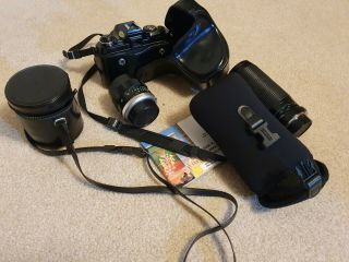 Minolta X570 SLR camera W/3 lenses,  6 filters,  leather cases 2