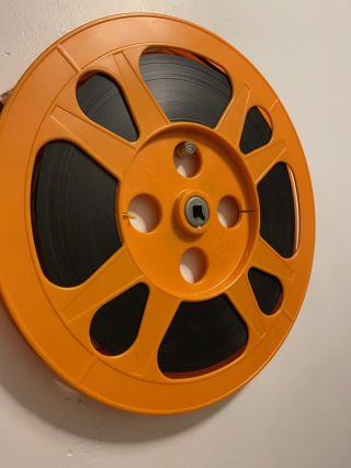 10.  5” Orange plastic film reel 16MM with film 2