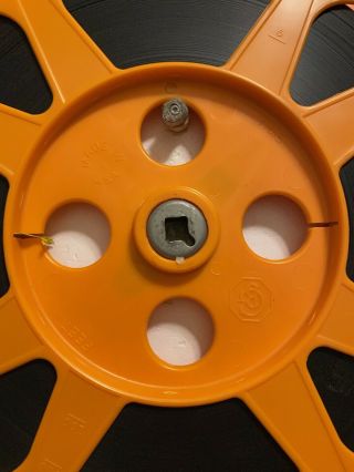 10.  5” Orange plastic film reel 16MM with film 3