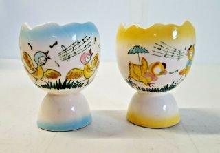 Two Vintage Egg Cups Blue Yellow Porcelain Singing Birds Boy & Girl 6017