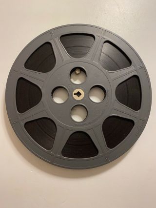 10.  5” Dark Gray Plastic Film Reel 16mm With Film And Case
