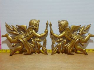 Two Mid Century Sexton Gold Painted Metal Cherub Wall Hangings