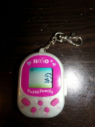 Vintage Playmates Toys Nano Puppy Family Virtual Pet Pink.