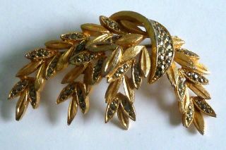 A Vintage 1950s Gold Tone Sphinx Designer Leaves Shaped Brooch With Marcasites
