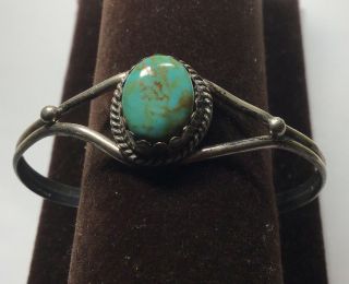 Vintage Navajo Sterling Silver Cuff Bracelet With A Turquoise Center Stone.