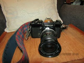 Vintage Nikkormat El 35mm Camera W/shoulder Strap.  Has Film Inside