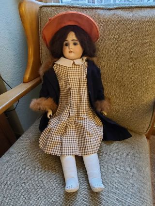 Antique Doll With Porcelain Head And Leather Body