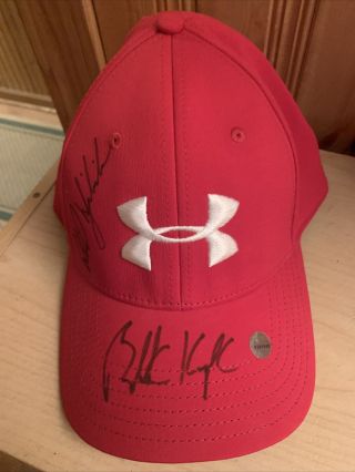 Under Armor Cap Signed By Phil Mickelson And Brooks Koepka.