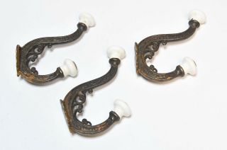 3 VINTAGE MATCHING VICTORIAN STYLE HAT OR COAT HOOKS WITH PORCELAIN TIPS 2