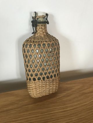 Vintage French Glass Wine Bottle In Wicker Casing - Stopper