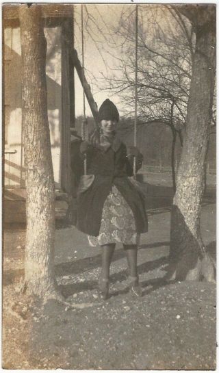 Pretty Young Woman In Coat & Hat On Swing In Pine Trees Vintage Snapshot