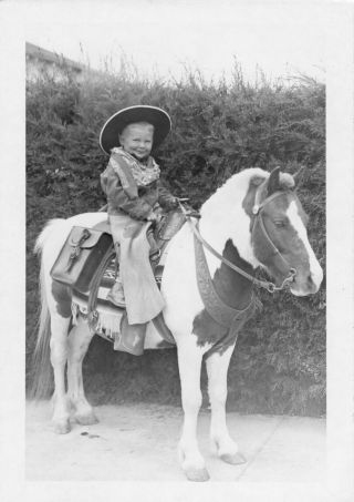 Little Boy Cowboy On Pony Smiling Vintage Photo Snapshot 1950 