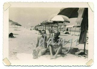 Two Swimsuit Men Sitting On The Beach With Feet In Camera Old Photo