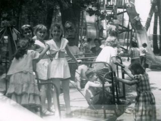 1965 Children Playing On Merry Go Round Playground