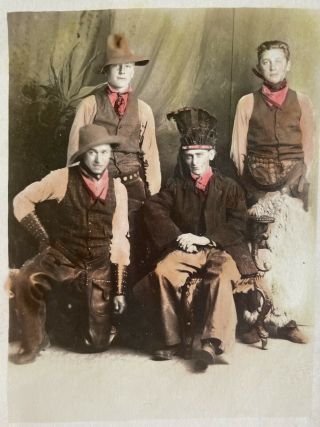 colorized RPPC Studio View of four western cowboys.  One In Native Headdress 2
