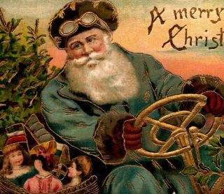 C 1910 Blue Robed Santa St Nick Fur Hat Goggles Drives Car Basket Toys Postcard