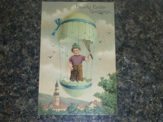 Easter Greetings Boy In An Egg Balloon Above A Church Pfb Postcard 7488 Relief
