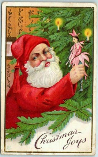 Christmas Postcard Santa Claus Putting Jester Ornament On Xmas Tree - - S498