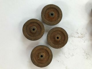 Four Carlisle and Finch cast iron car wheels,  rare, 3