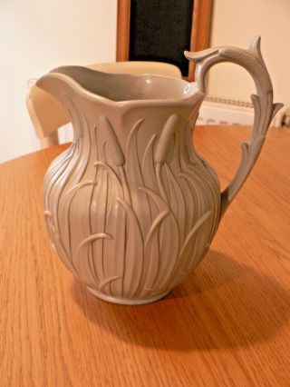 An Antique Relief Moulded Drabware Jug.  Possibly Ridgway.  Registration Mark