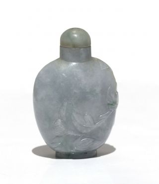 A Chinese Carved Jade Snuff Bottle And Stopper