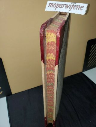 Antique ledger.  Hardcover with patterned page edges.  Very Heavy. 2