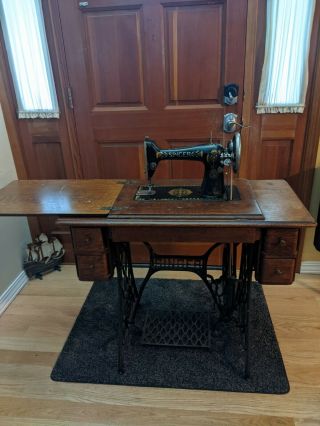 Antique Singer Sewing Machine With Treadle And Cabinet