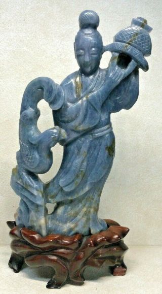 Chinese Carved Jade Or Blue Stone Figure Of An Immortal With Wood Stand