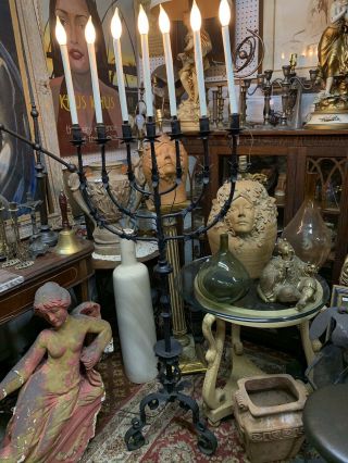 An Vintage Wrought Iron Floor Candelabra 65”tall 2ft.  Heavy.