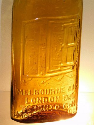 ANTIQUE BOTTLE GOLDEN YELLOW AMBER WARNER ' S SAFE CURE 4 CITYS OLD BOTTLE 1890 ' s 2